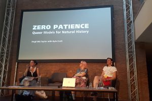 Panorama: Science, Medicine & Natural History: Queering Scientific ALMS: Presentation by Virgil B/G Taylor (on screen); from left: Jen Grove, Ellie Armstrong, Kate Davison; Photo: Anahí Farji Neer